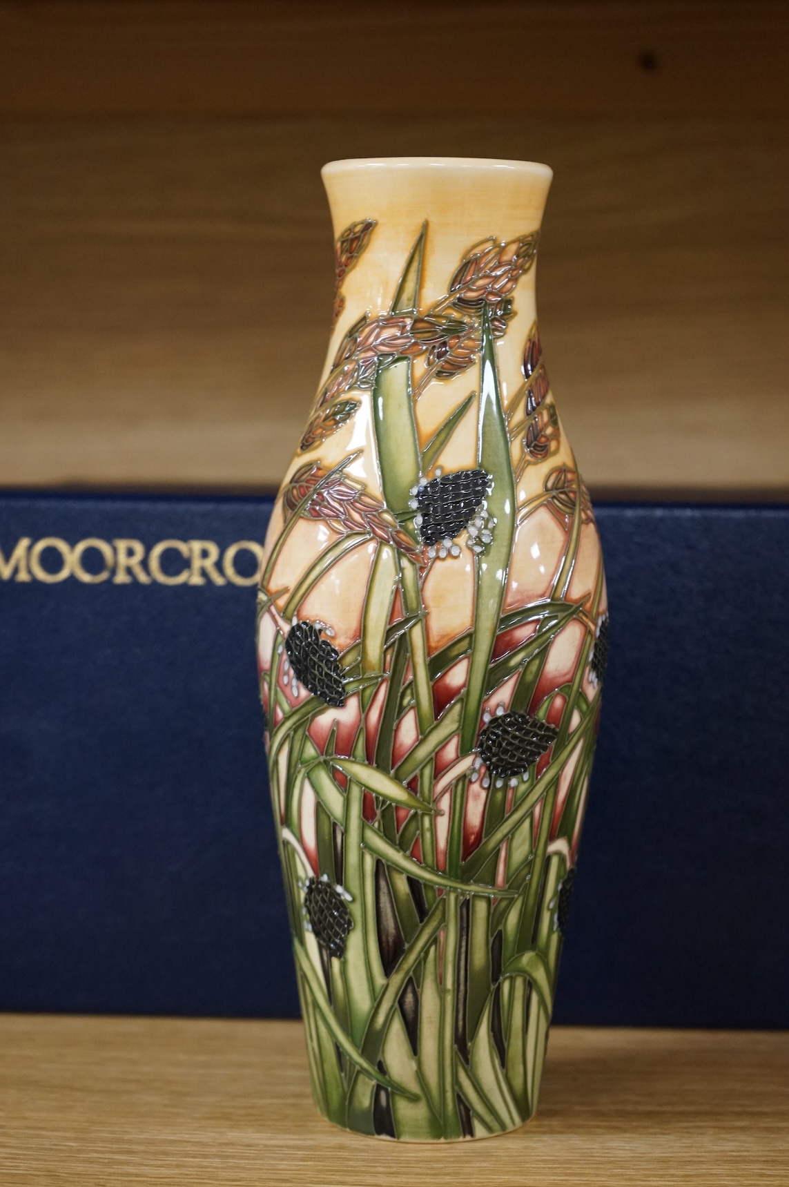 A boxed Moorcroft limited edition Savannah vase by Emma Bossons, 259/500, signed and dated 2001, 25cm